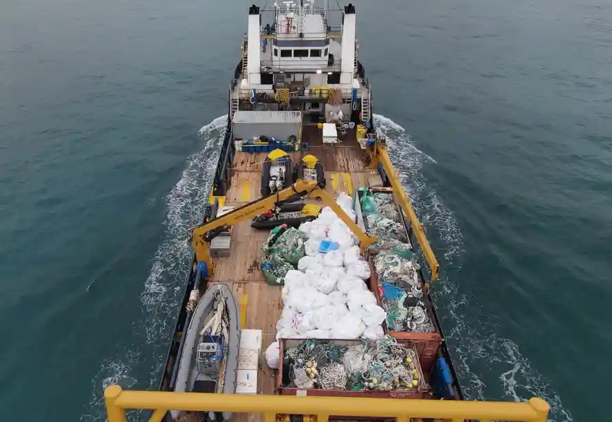 Aerial view of a ship loaded with derelict fishing gear.