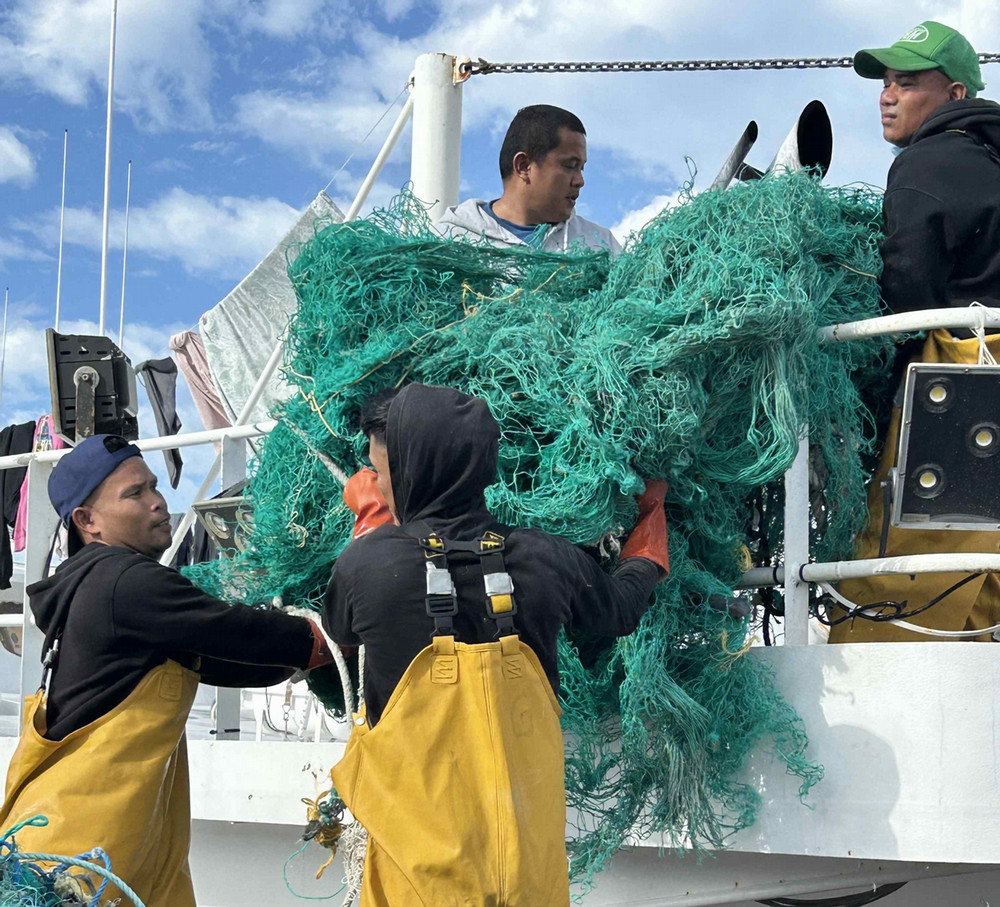 Fishers removing nets